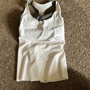 Athleta womens sports bra connected with tank top. Size xs, removable pads